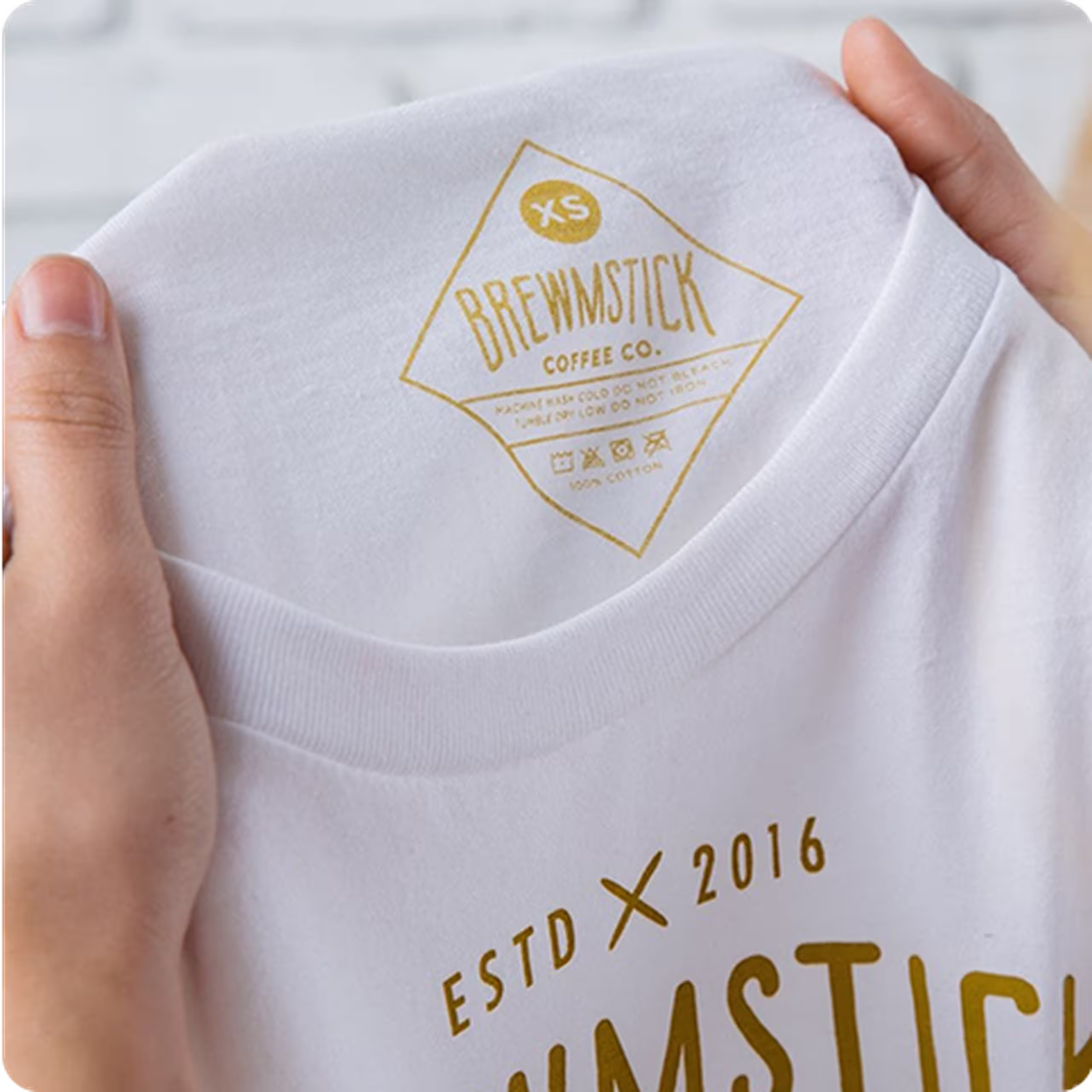 close up of a golden color custom printed tag