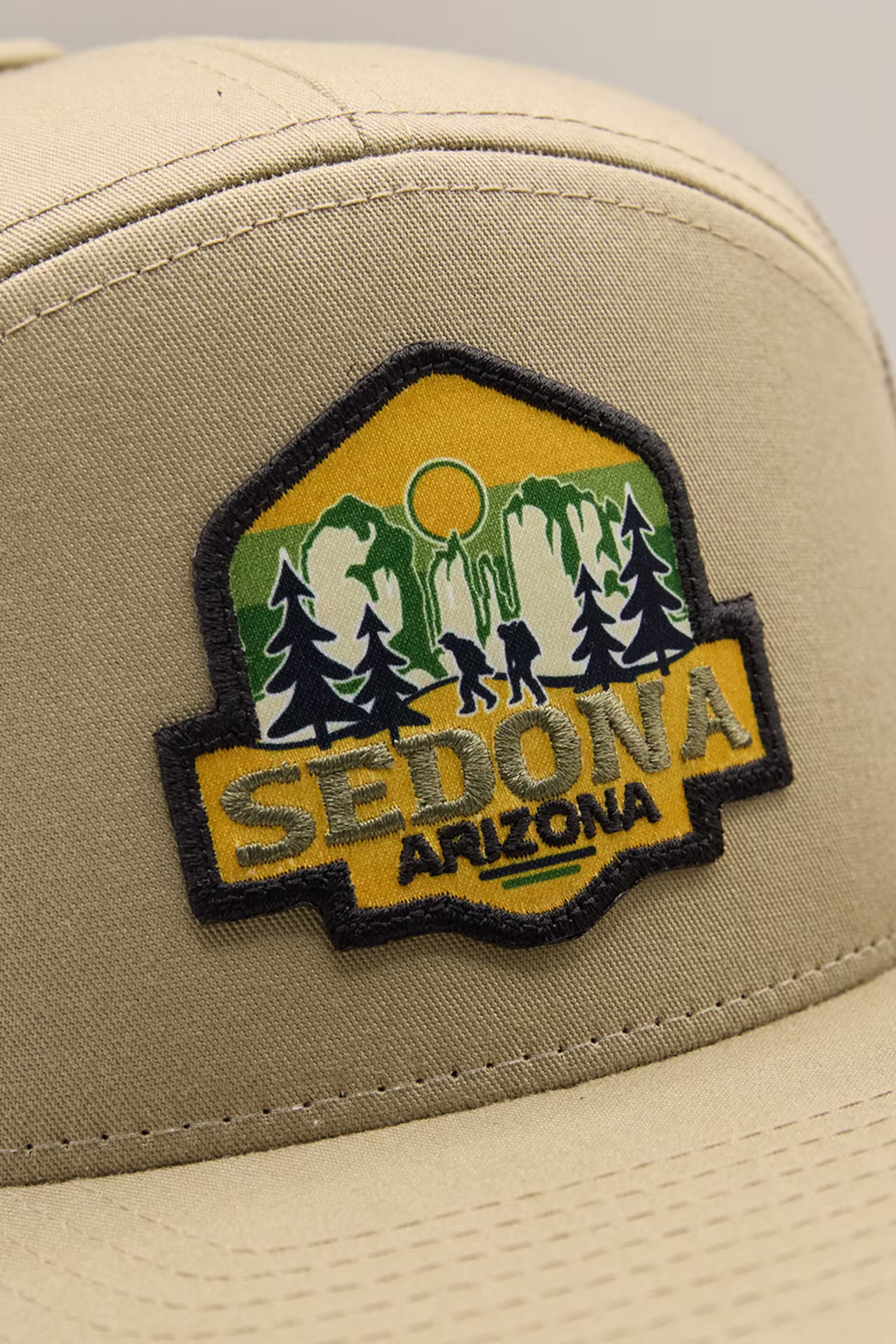 a yellow and black print stitch patch with an illustration of a forest with the words Sedona, Arizona