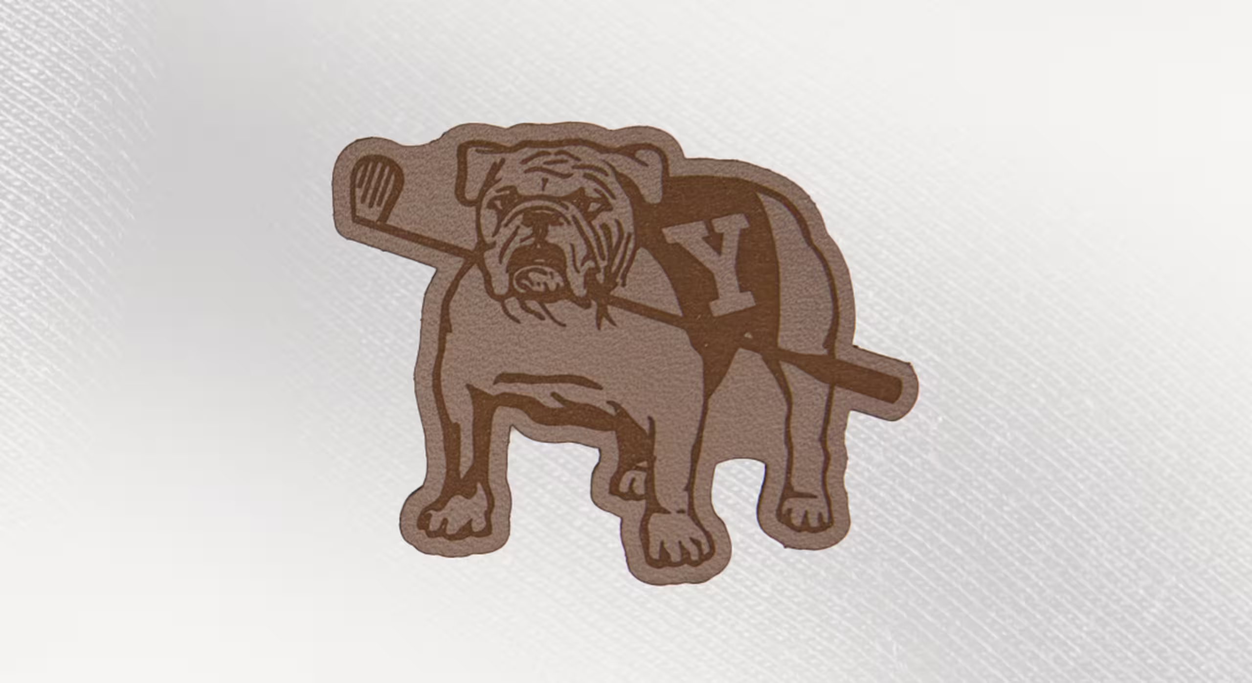 a leather patch of a dog and a golf club